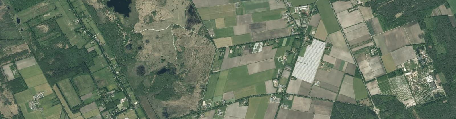 Luchtfoto van Verspreide huizen Evertsoord