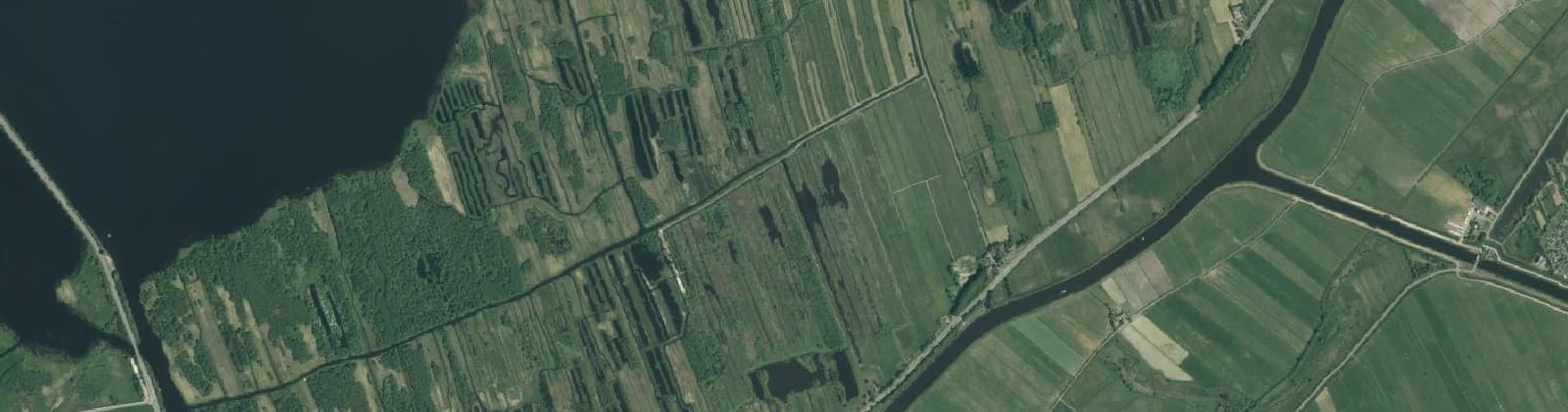 Luchtfoto van Verspreide huizen Zomerdijk