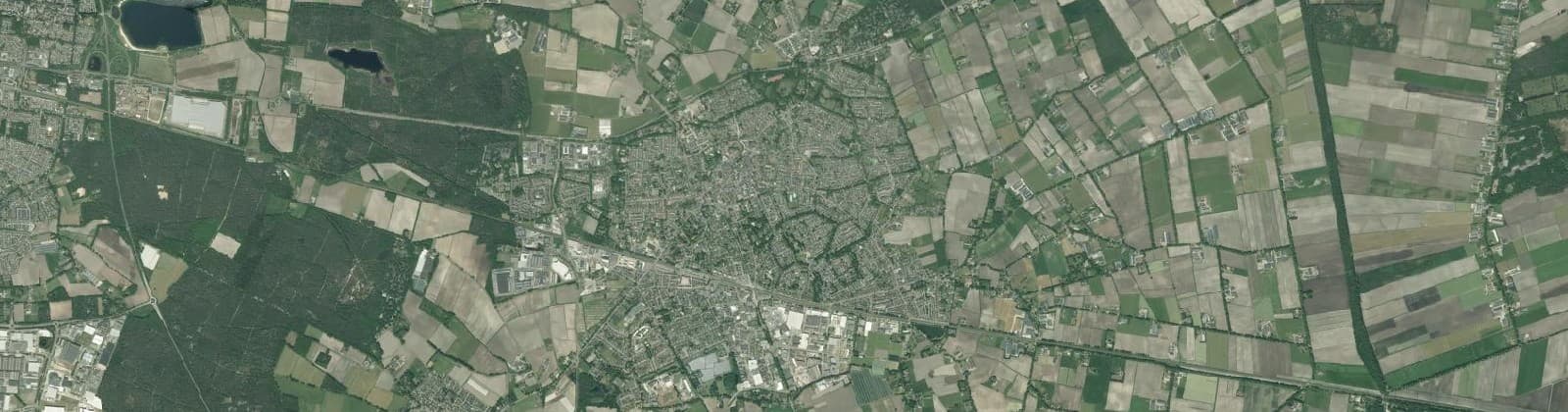 Luchtfoto van Verspreide woningen bij Deurne